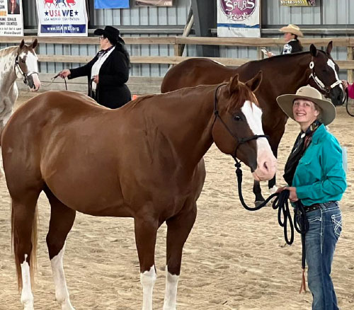 woman in halter class with her horse